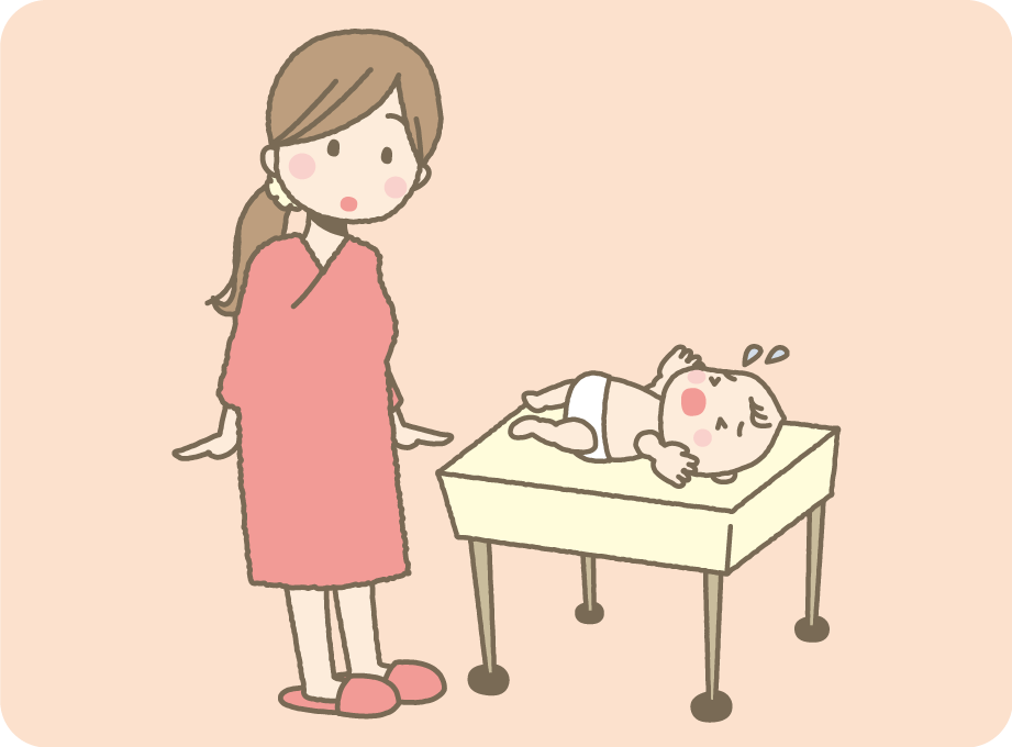 ベッドで泣く赤ちゃんの様子を見る母親